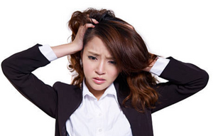 Asian woman scratching her hair